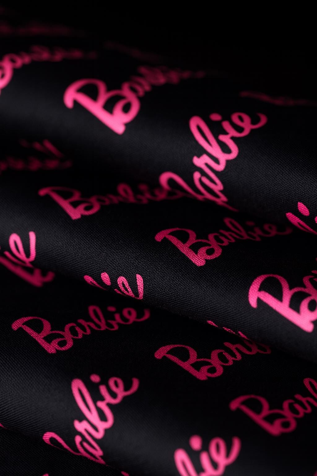 Barbie Fabric: Pink Logo Text, Black Linen-Look Polyester, 44" Wide